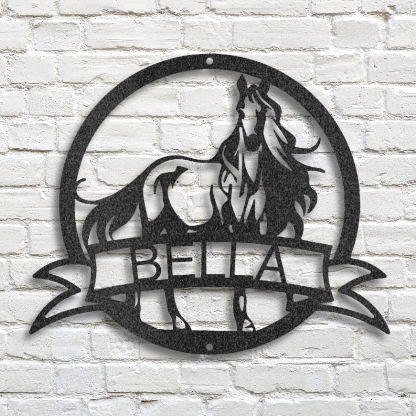 Decorative metal wall art of a horse with you custom name on a white brick wall background.