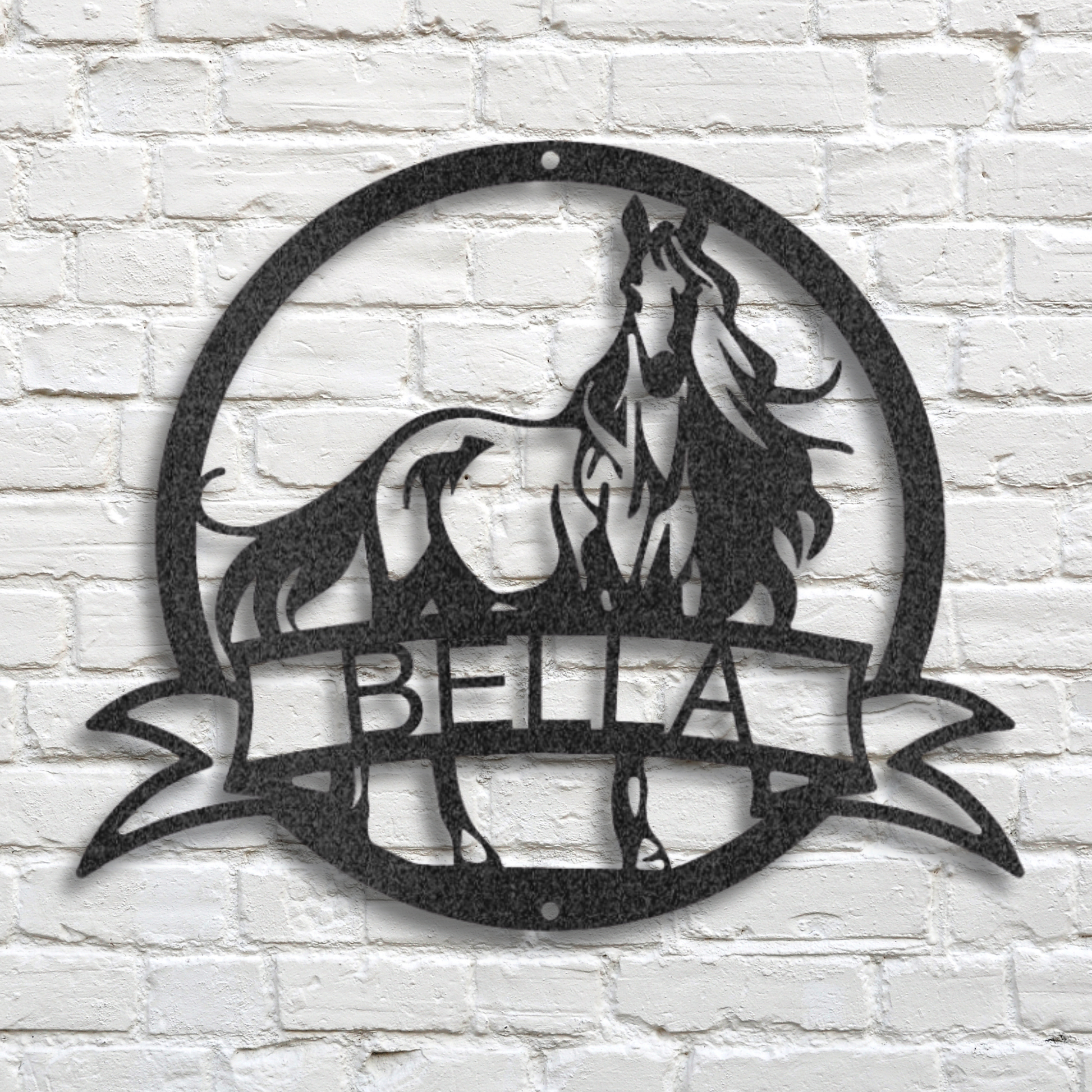 Decorative metal wall art of a horse with you custom name on a white brick wall background.